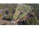Aerial view showing the property lines and wooded surrounding at 675 Mayes, Powder Springs, GA 30127