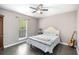 Charming bedroom featuring a ceiling fan, hardwood floors, and natural light from a window at 675 Mayes, Powder Springs, GA 30127