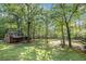 Charming wooded lot featuring an outbuilding and plenty of green space at 675 Mayes, Powder Springs, GA 30127