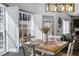 Cozy dining area filled with natural light, plantation shutters and adjoins the kitchen and living room at 949 Tumlin Trce, Lawrenceville, GA 30045