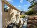 Side exterior shot showing the patio, landscaping, and design of the home at 949 Tumlin Trce, Lawrenceville, GA 30045