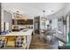 Open concept kitchen and dining area with modern cabinetry, stainless steel appliances, and ample counter space at 949 Tumlin Trce, Lawrenceville, GA 30045