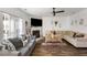 Open living room with fireplace, ceiling fan, and comfortable seating arrangement at 949 Tumlin Trce, Lawrenceville, GA 30045