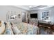 Cozy main bedroom with modern decor, a window seat, and great natural light at 949 Tumlin Trce, Lawrenceville, GA 30045