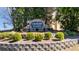 Stone entrance sign at Creekside Estates with landscaping and greenery at 949 Tumlin Trce, Lawrenceville, GA 30045