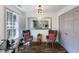 Sitting area with comfortable seating, natural light, and luxury vinyl plank flooring throughout at 949 Tumlin Trce, Lawrenceville, GA 30045