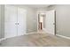 Bedroom featuring carpet floors, closet with double doors, and a view to the hallway at 1777 Meadow Sw Ln, Atlanta, GA 30315