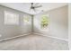 Bedroom featuring carpet floors, large windows, and a ceiling fan at 1777 Meadow Sw Ln, Atlanta, GA 30315