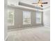Bedroom with carpet floors, three windows, and a tray ceiling at 1777 Meadow Sw Ln, Atlanta, GA 30315