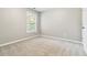 Bright bedroom with a window providing natural light and neutral carpet at 1777 Meadow Sw Ln, Atlanta, GA 30315
