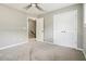 Bedroom featuring carpet floors, closet with double doors, and a ceiling fan at 1777 Meadow Sw Ln, Atlanta, GA 30315
