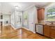 Cozy dining area next to the kitchen with stainless steel dishwasher and a view of the backyard at 1777 Meadow Sw Ln, Atlanta, GA 30315