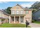 Charming two-story home featuring a welcoming front porch and well-maintained lawn in a residential neighborhood at 1777 Meadow Sw Ln, Atlanta, GA 30315