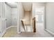 Hallway featuring carpet, an adjacent laundry room, and an open door to another room at 1777 Meadow Sw Ln, Atlanta, GA 30315