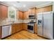 Well-lit kitchen featuring stainless steel appliances and granite countertops at 1777 Meadow Sw Ln, Atlanta, GA 30315