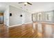 Open-concept living room with hardwood floors, staircase, and great natural light near the kitchen at 1777 Meadow Sw Ln, Atlanta, GA 30315