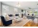 Bright living room featuring a fireplace, hardwood floors, and comfortable seating at 1777 Meadow Sw Ln, Atlanta, GA 30315