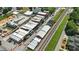An aerial view shows the commercial district with parking, railway line and mixed brick and flat roofed buildings at 2995 Ivy Mill Dr, Buford, GA 30519