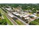 An aerial view showcases the town with trees, roads, houses and a railway line running through the heart of the town at 2995 Ivy Mill Dr, Buford, GA 30519
