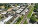 Wide aerial view showcases the commercial district with a prominent railway line through the center at 2995 Ivy Mill Dr, Buford, GA 30519