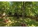 Expansive backyard featuring lush green grass and a wood fence at 2995 Ivy Mill Dr, Buford, GA 30519