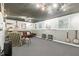 Finished basement with gray carpet, ample lighting, and plenty of room for entertaining at 2995 Ivy Mill Dr, Buford, GA 30519
