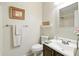 Clean, neutral toned bathroom with a white sink and vanity, toilet and tub shower combination at 2995 Ivy Mill Dr, Buford, GA 30519