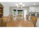 Dining area with a wooden table, chairs, and a bay window at 2995 Ivy Mill Dr, Buford, GA 30519
