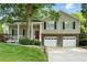 Beautiful home with a covered front porch and a two-car garage at 2995 Ivy Mill Dr, Buford, GA 30519