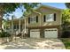 Attractive home featuring a covered front porch and a two-car garage at 2995 Ivy Mill Dr, Buford, GA 30519