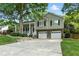 Charming two-story home featuring a welcoming front porch and a two-car garage at 2995 Ivy Mill Dr, Buford, GA 30519
