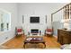 Bright living room with a fireplace, hardwood floors, and comfortable seating at 2995 Ivy Mill Dr, Buford, GA 30519