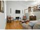 Spacious living room featuring a fireplace, hardwood floors, and ample seating at 2995 Ivy Mill Dr, Buford, GA 30519