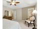 Cozy carpeted main bedroom features neutral walls, a ceiling fan, and natural light through a large window at 2995 Ivy Mill Dr, Buford, GA 30519