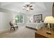 Bright main bedroom with trey ceiling, carpet, ceiling fan, and large window for ample lighting at 2995 Ivy Mill Dr, Buford, GA 30519