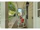Inviting porch featuring white columns and comfortable rocking chairs with red pillows at 2995 Ivy Mill Dr, Buford, GA 30519