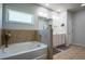 Cozy bathroom featuring a tub and decorative flowers at 3222 Long Creek Dr, Buford, GA 30519