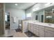 Bright bathroom with double vanity, soaking tub, and walk-in closet access at 3222 Long Creek Dr, Buford, GA 30519