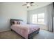 Cozy bedroom with a double bed, neutral carpet, and a large window for natural light at 3222 Long Creek Dr, Buford, GA 30519
