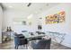 Bright dining room featuring modern decor with a large glass table and a large mirror at 3222 Long Creek Dr, Buford, GA 30519