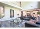 Open-concept living room featuring a high ceiling, large windows, and modern furniture at 3222 Long Creek Dr, Buford, GA 30519