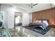 Spacious main bedroom featuring a wood accent wall and a full-length mirror at 3222 Long Creek Dr, Buford, GA 30519