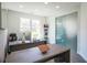 Bright home office with two desks and a glass door with natural light at 3222 Long Creek Dr, Buford, GA 30519