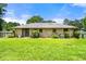 This backyard features a grassy lawn with a brick exterior at 3405 Leisure Ln, Atlanta, GA 30349