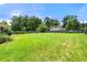 This backyard features a grassy lawn with a wooden fence at 3405 Leisure Ln, Atlanta, GA 30349