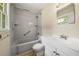 This bathroom features a shower and bathtub combination, a vanity with a sink, and neutral fixtures at 3405 Leisure Ln, Atlanta, GA 30349
