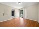 Spacious bedroom featuring wood flooring and backyard access at 3405 Leisure Ln, Atlanta, GA 30349