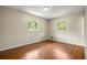 This bedroom features neutral walls, hardwood floors, and natural light at 3405 Leisure Ln, Atlanta, GA 30349