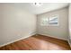 This bedroom features neutral walls, hardwood floors, and ample natural light at 3405 Leisure Ln, Atlanta, GA 30349