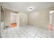 Bright dining room features stylish tile flooring and access to other rooms of the home at 3405 Leisure Ln, Atlanta, GA 30349